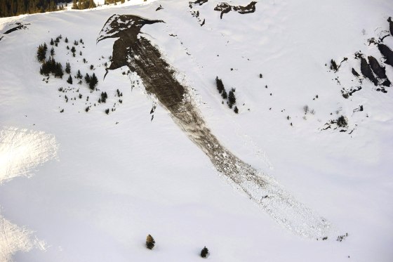 Rescue workers search for victims after avalanche in Switzerland
