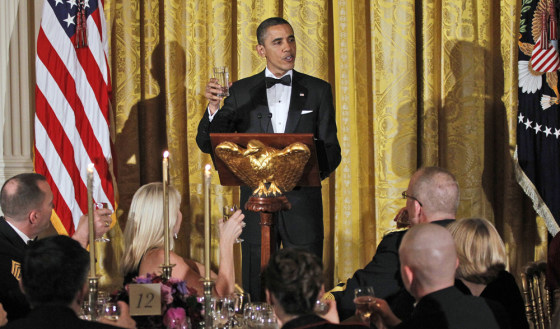 President Barack Obama leads guests to a toast as he hosts a dinner for members of the U.S. military who served in Iraq in the East Room of the White House in Washington, Wednesday, Feb., 29, 2012. (AP Photo/Pablo Martinez Monsivais)