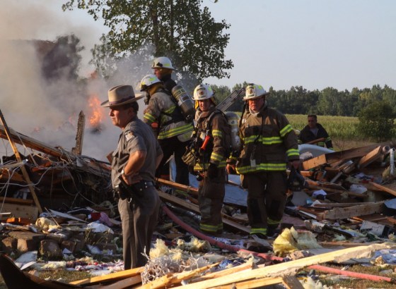 Emergency personnel work the scene around a house after an explosion on July 24, in Wilson, N.Y.