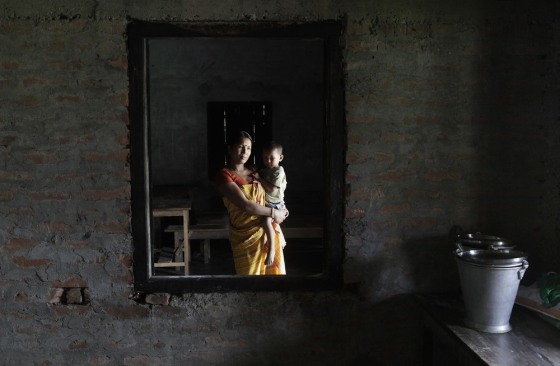 Urmila Gayari, a Bodo woman affected by ethnic violence, holds her two-year-old son at a relief camp at Bijni in Chirang District, Assam, India on July 26.