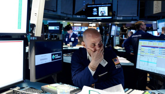 A trader works on the floor of the New York Stock Exchange, June 1, at the Closing Bell in New York City. The Dow Jones Industrial average lost 277 points after the release of a disappointing jobs report.