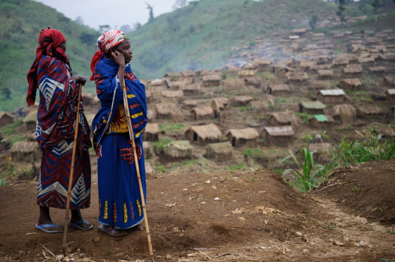 Two displaced Congolese women stand above new homes built in a camp for the internally displaced in Katoyi in Masisi territory in the Democratic Republic of the Congo's North Kivu on Monday. Katoyi has seen four waves of people arriving since last September following fights in the area between FDLR (Democratic Forces for the Liberation of Rwanda) and Maï-Maï armed groups. The most recent wave, beginning on May 14, has brought some 1500 families to Katoyi fleeing what they describe as attacks by the Maï Maï Raïa Mutomboki armed group, with various sources in Katoyi confirming the deaths of over 100 people over the past few weeks.