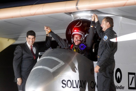 Solar Impulse pilots Bertrand Piccard, center, celebrates with Andre Borschberg, right, and Mustapha Bakkoury, president of the Moroccan Agency for Solar Energy upon arrival at Rabat airport, Morocco on Tuesday.