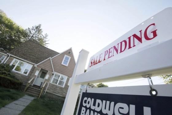 In this April 26, 2012, file photo, a sign advertises a pending residential real estate sale in Framingham, Mass.