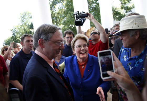 University of Virginia President Teresa Sullivan weaves through supporters and media after she was reinstated on Tuesday.