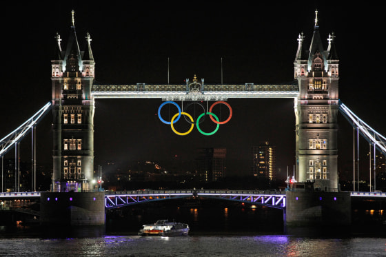 The Olympic rings are seen atop the iconic Tower Bridge over river Thames in London, coinciding with one month to go until the start of the London 2012 Games, Wednesday, June 27, 2012.