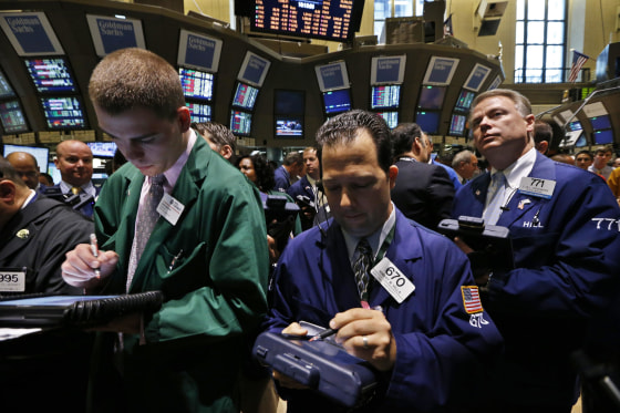Traders work on the floor of the New York Stock Exchange.