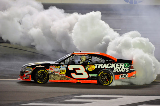 Austin Dillon celebrates his win with a burnout after the NASCAR Nationwide Series auto race at Kentucky Speedway, Friday, June 29, 2012, in Sparta, Ky.
