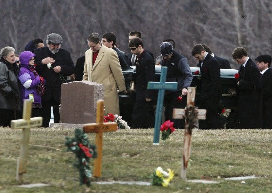 The casket of slain Chardon High School student Daniel Parmertor is carried to his gravesite in Chardon, Ohio March 3, 2012. Prosecutors in Ohio on Thursday formally charged 17-year-old T.J. Lane with three counts of aggravated murder, two counts of aggravated attempted murder and one count of felonious assault in Monday's shooting rampage at Chardon High School that claimed three students' lives. REUTERS/Shannon Stapleton (UNITED STATES - Tags: CIVIL UNREST EDUCATION CRIME LAW)