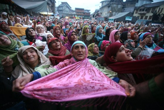 epa03132812 Kashmiri Muslim devotees pray as the head priest (not pictured) displays a relic of Sufi Saint Syed Abdul Qadir Jilani, during the saint's birth anniversary in Srinagar, the summer capital of Indian Kashmir, 05 March 2012. Reports state that hundreds of devotees offered prayers on the annual festival at the shrine of Jilani. EPA/FAROOQ KHAN