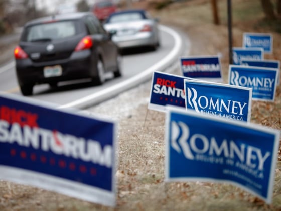 BEDFORD, NH - JANUARY 06: Campaign signs for Republican presidential candidates former U.S. Senator Rick Santorum (R-PA) and former Massachusetts Gov. Mitt Romney line a road January 6, 2012 in Bedford, New Hampshire. After coming in second place by only eight votes behind former Massachusetts Governor Mitt Romney in the Iowa Caucuses, Santorum trying tio riding that momentum into next week's New Hampshire GOP primary. (Photo by Chip Somodevilla/Getty Images)