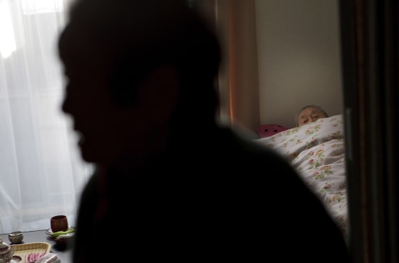 Fukuko Hatakeyama, 81, front, lives with her bedridden husband in a temporary house in Kesennuma, Miyagi, Japan on Feb 6, 2012. Massive tsunami hit northern Japan on March 11, 2011 sweeping away her house and all her belongings, including cash savingsPhoto by Kuni Takahashi