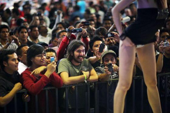 In this photo taken on Friday, March 2, 2012, an exotic dancer performs during the 2012 Sex and Entertainment Expo in Mexico City. The Sex and Entertainment Expo is an annual event where vendors in the sex industry promote their goods and local strip clubs offer a glimpse of their establishments. This year is the event's ninth consecutive year. (AP Photo/Alexandre Meneghini)