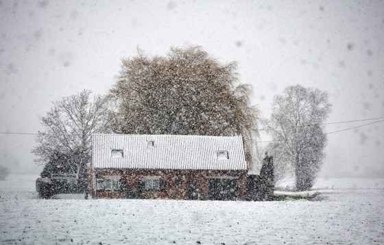 TOPSHOTS-A picture shows a snow-covered house, on March 5, 2012 in Armentieres, northern France, after heavy snow-falls which disturbed the traffic around Lille. AFP PHOTO PHILIPPE HUGUEN (Photo credit should read PHILIPPE HUGUEN/AFP/Getty Images)