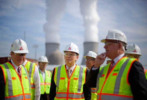 U.S. Secretary of Energy Secretary Steven Chu, center, tours the Vogtle nuclear power plant with Southern Company President and CEO Thomas Fanning, left, and The Shaw Group Chairman, President and CEO J.M. Bernhard Jr., during a visit Wednesday, Feb. 15, 2012, in Waynesboro, Ga. Chu's visit to east Georgia comes a week after the Nuclear Regulatory Commission approved a license for the Southern Co. to build a third and fourth reactor at Plant Vogtle. They will be the first commercial reactors built in the U.S. in more than 30 years. (AP Photo/David Goldman, Pool)