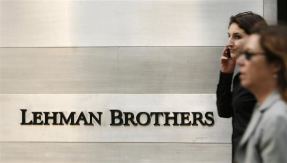 Pedestrians walk past a Lehman Brothers sign in New York, June 19, 2008. REUTERS/Lucas Jackson