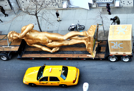 A 30 foot (9.1 meters) replica of Michelangelo's David by Turkish conceptual artist Serkan Ozkaya titled "David (inspired by Michelangelo)" is parked in front of the Storefront for Art and Architecture March 6, 2012 in the Soho area of New York. The statue is in New York for one day before heading to be exhibited at the 21c Museum in Louisville, Kentucky. AFP PHOTO/Stan HONDA (Photo credit should read STAN HONDA/AFP/Getty Images)