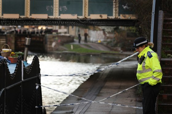 LONDON, ENGLAND - MARCH 07: A police officer stands next to an area of Regents Canal in Hackney near where a torso was discovered on March 7, 2012 in London, England. Police have arrested a 35 year old man in connection with the find. Local reports say the body may be that of a missing actress Gemma McCluskie, 29, who appeared in BBC television soap opera Eastenders in 2001. (Photo by Peter Macdiarmid/Getty Images)