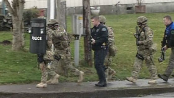 Police gased and entered a house in Montesano, Wash., where a man suspected of shooting a sheriff's deputy and stabbing a judge was initially believed to be holed up. He wasn't there.