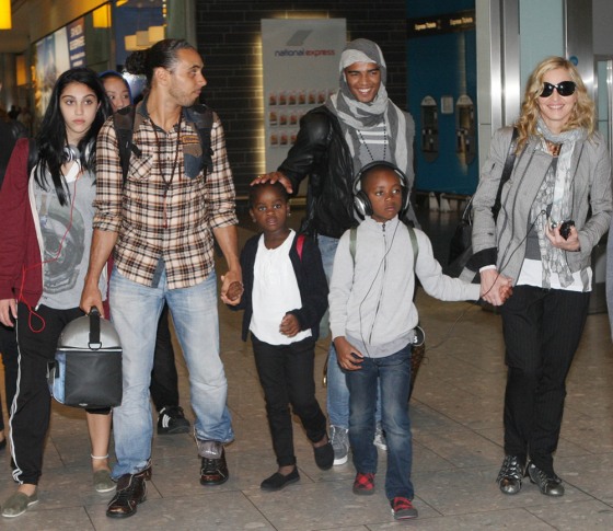 Madonna and her Boyfriend arrive at Heathrow Airport. Madonna's boyfriend is pictured being friendly with the children as he touches down at Heathrow. Pictured: Madonna, Braihim Zaibat, Lourdes Ciccone Leon, Mercy Ritchie and David Banda
