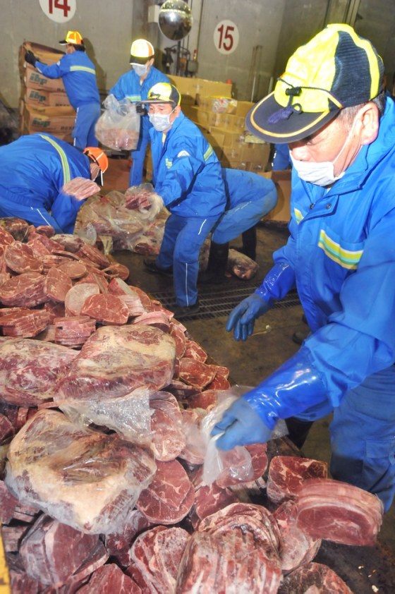 Workers carry US beef laden with ractopamine, a controversial additive used to promote lean meat, at a furnace in downtown Taipei on March 12, 2012. More than six tonnes of such beef imported by a local company that contained the drug allowed in the US but banned in Taiwan was destroyed. The move came as Taiwanese government is mulling a plan to lift a ban on ractopamine-treated US beef to facilitate stalled trade talks with the US, a key trading partner and arms supplier of the politically isolated island. AFP PHOTO / Mandy CHENG (Photo credit should read Mandy Cheng/AFP/Getty Images)