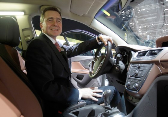 Karl-Friedrich Stracke, CEO of Adam Opel AG, sits inside the new Opel (Vauxhaull) Mokka on Tuesday, March 6, 2012 during the press preview days at the 82nd Geneva International Motor Show in Geneva, Switzerland. The Motor Show will open it's doors to the public from March 8 to 18, presenting more than 260 exhibitors and more than 180 world and European premieres. (AP Photo/Frank Augstein)