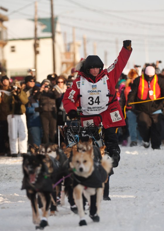 Dallas Seavey reaches the finish line to claim victory in the Iditarod Trail Sled Dog Race in Nome, Alaska, on Tuesday, March 13, 2012. (AP Photo/Marc Lester, Anchorage Daily News )