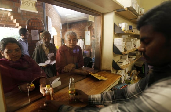 In this photo taken Tuesday, March 13, 2012, survivors of the 1984 gas leak at the Union Carbide plant wait to receive medication at a clinic in Bhopal, India. The survivors of the tragedy of 27 years ago, with their lingering illnesses, sick children and dead relatives, faded away from the world's memory, even as their suffering went on. Now, though, they have seized on a new chance to force their plight in front of the world, the London Olympics. (AP Photo/Rafiq Maqbool)
