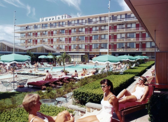 This undated photo provided by Marriott International Inc., shows the swimming pool at the Twin Bridges Marriott, in Arlington Va. In 1957, John Willard Marriott and Alice Sheets Marriott opened their first hotel _ the Twin Bridges Motor Hotel in Arlington, Va. But it was their son Bill who transformed the company into a global hotel giant. Today there are 3,718 Marriott hotels in 73 countries. The company’s other businesses have been sold.. (AP Photo/Marriott International Inc.)
