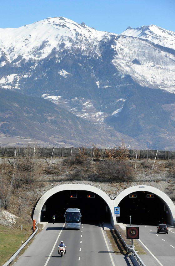 A bus with the relatives of victims leaves the tunnel after they paid tribute at the site of the accident in Sierre, western Switzerland, Thursday, March 15, 2012. Twenty-eight people, including 22 children, returning to Belgium from a skiing holiday died in a bus accident in Sierre in the Swiss canton of Valais, Swiss police said Wednesday. (AP Photo/Keystone, Olivier Maire)