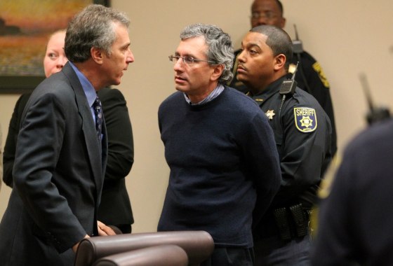 Hemy Neuman, center, prepares to leave the courtroom as Chief Assistant DA Don Geary talks to Neuman after the reading of the verdict at the DeKalb County Courthouse Thursday, March 15, 2012 in Decatur, Ga. Neuman, a corporate engineer who fawned over a female subordinate was found guilty but mentally ill Thursday of killing Russell Sneiderman outside of a suburban Atlanta preschool. The jury's guilty but mentally ill verdict means Neuman will go to prison but he will get mental health treatment. He is set to be sentenced later Thursday and faces up to life in prison. (AP Photo/Atlanta Journal-Constitution, Jason Getz) MARIETTA DAILY OUT; GWINNETT DAILY POST OUT