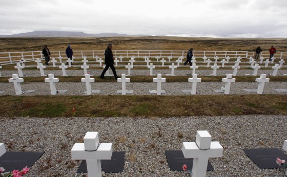 Argentine Falklands War veterans walk among the tombstones to pay homage to Argentine soldiers who died during the conflict at Darwin cemetery, in the Falkland Islands on Sunday. Diplomatic tensions between Argentina and Britain have been rising in the runup to the 30th anniversary of the war they fought over the islands.