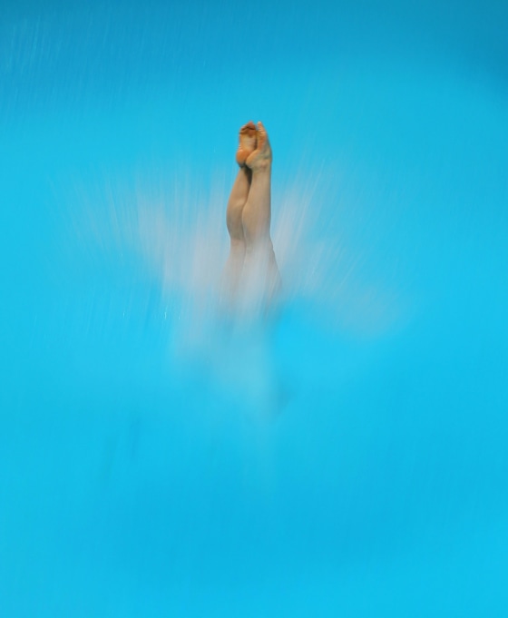 epa03147310 Roseline Filion of Canada competes in the women's 10M Platform event of the FINA/Midea Diving World Series Dubai 2012 at the Aquatic Centre at Hamdan Bin Mohammed Bin Rashid Sports Complex in the Gulf emirate of Dubai, United Arab Emirates, 16 March 2012. EPA/ALI HAIDER
