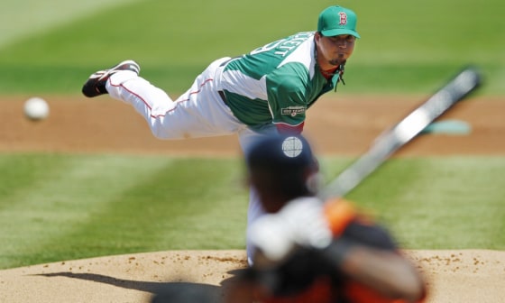 Boston Red Sox starter Josh Beckett delivers to Baltimore Orioles' Wilson Betemit during the first inning of a spring training baseball game in Fort Myers, Fla. on Saturday. The Red Sox wore green unifroms in celebration of St. Patrick's Day.