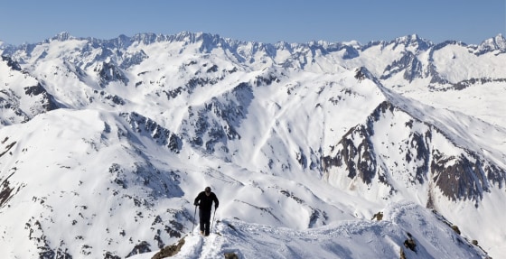 In this picture taken Friday March 16, 2012, a touring skier is on his way towards the Piz Maler, near Sedrun, Switzerland. 