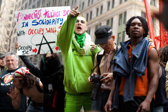 An Occupy Wall Street protestor yells at the police after arrests were made following a march to celebrate the protest's sixth month on Saturday. With the city's attention focused on the huge St. Patrick's Day Parade many blocks uptown, the Occupy rally at Zuccotti Park on Saturday drew a far smaller crowd than the demonstrations seen in the city when the movement was at its peak in the fall. A couple hundred people attended. 