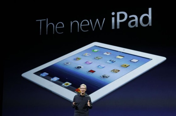 Apple CEO Tim Cook introduces the new iPad during an Apple event in San Francisco, California March 7, 2012. REUTERS/Robert Galbraith