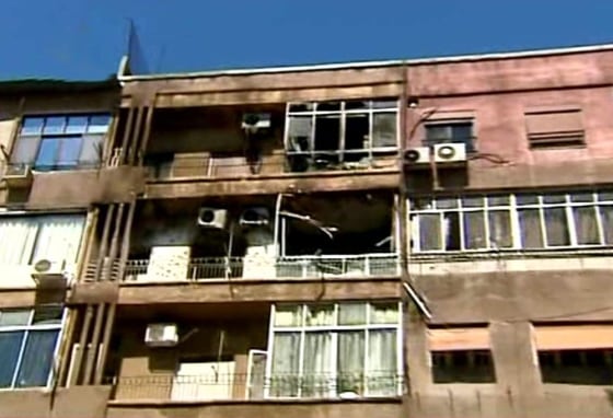 In this photo released by the Syrian official news agency SANA, damaged apartments are seen after a clashes between the Syrian rebels and the Security forces, in the Mazzeh neighborhood of Damascus, Syria, on Monday, March 19, 2012. Rare gun battles between security forces and rebels broke out Monday in an upscale Damascus neighborhood where embassies are located and senior officials live, one of the most serious confrontations in the tightly controlled capital since the anti-government uprising began a year ago. At least three people were killed. The state-run news agency SANA reported that Monday's fighting broke out when security forces stormed an apartment used as a hideout by an