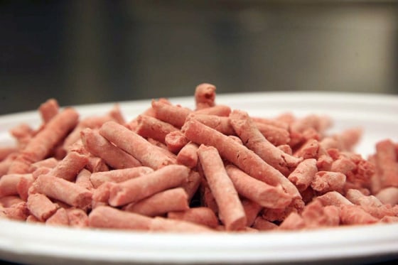 In this undated image released by Beef Products Inc., boneless lean beef trimmings are shown before packaging. The debate over “pink slime” in chopped beef is hitting critical mass. The term, adopted by opponents of “lean finely textured beef,” describes the processed trimmings cleansed with ammonia and commonly mixed into ground meat. Federal regulators say it meets standards for food safety. Critics liken it to pet food _ and their battle has suddenly gone viral amid new media attention and a snowballing online petition. (AP Photo/Beef Products Inc.)
