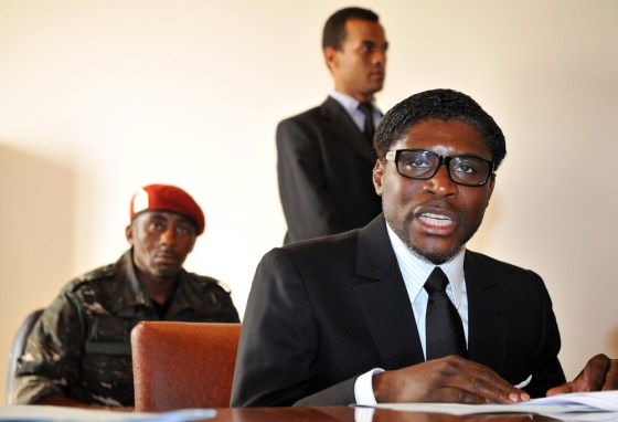 (FILES) This file picture taken on January 24, 2012 shows Teodoro Nguema Obiang Mangue, (R), son of the Equatorial Guinea's President, speaking in Mbini-Rio Benito, south of Bata. French police on February 14, 2012 searched an upmarket Paris residence of the son of Equatorial Guinea's President Teodoro Obiang Nguema as part of a corruption probe, sources close to the matter told AFP. The president's son, Teodoro Obiang Mangue, was reportedly absent during the search by anti-graft police who were met with some resistance from occupants who claimed the building was protected by diplomatic immunity. AFP PHOTO / ABDELHAK SENNA (Photo credit should read ABDELHAK SENNA/AFP/Getty Images)
