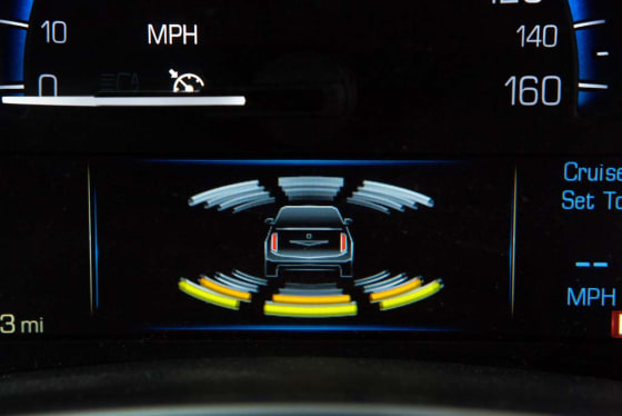 Cadillac's latest safety technologies include graphics on the gauge cluster that indicate when an object has been detected in the path of the vehicle.