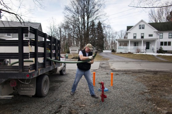 Ray Kimble fills up a 500 gallon water tank, called a buffalo, with fresh water which he will then distribute daily to neighbors whose water is non-potable near Dimock, Pennsylvania, March 8. The controversial drilling practice known as hydraulic fracturing, or fracking, has left much of the water in Northeastern Pennsylvania non-potable, leaving many residents to rely on outside water distribution.