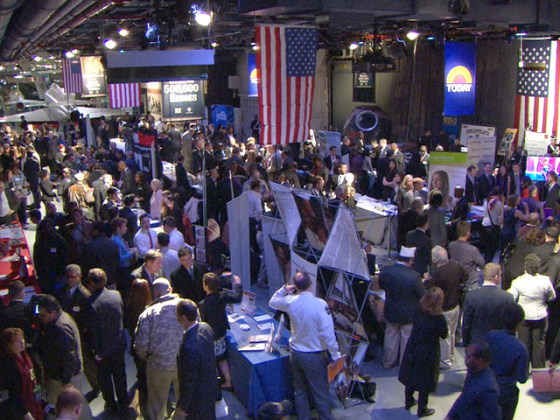 A crowd of veterans and military spouses attend a career fair on the NYC USS Intrepid.