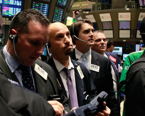 Traders work on the floor of the New York Stock Exchange.
