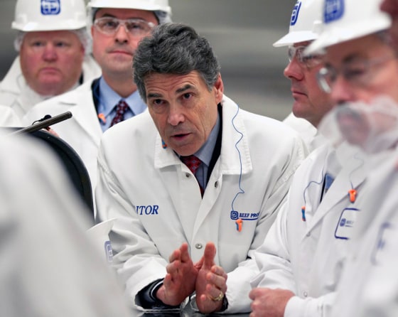 Texas Gov. Rick Perry speaks with workers at a meat plant Thursday in South Sioux City, Neb.