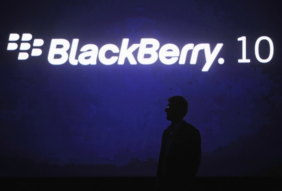 RIM's CEO Thorsten Heins is silhouetted during a BlackBerry event in Orlando in early May.