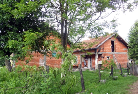 An undated picture shows the house where a girl is alleged to have spent years in slavery in the Bosnian village of Karavlasi.