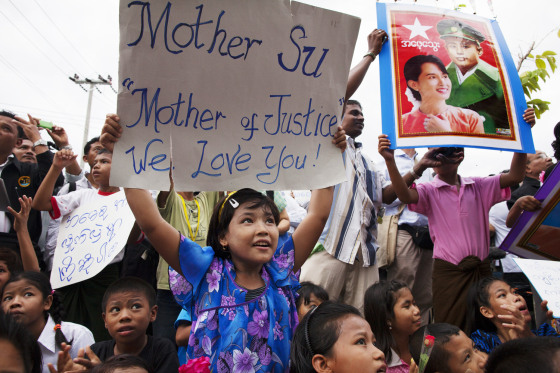 Pro-democracy leader Aung San Suu Kyi is greeted by supporters during a visit to an immigration center in the migrant workers community outside of Bangkok on May 31, in Mahachai, Thailand. Suu Kyi hopes to help improve the rights of Myanmar nationals living in Thailand. The Thailand trip is her first trip outside of Burma in 24 years as she attends the World Economic Forum on East Asia. Previously she was either under house arrest or too fearful to leave her home country incase the government didn't allow her return.