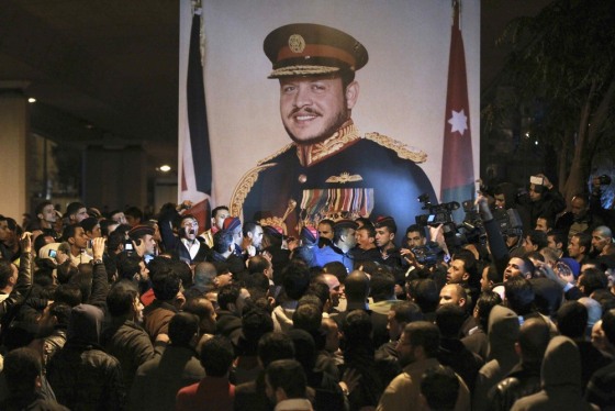 Jordanian gendarmerie police stand guard to separate pro-government supporters from anti-government protesters Tuesday.