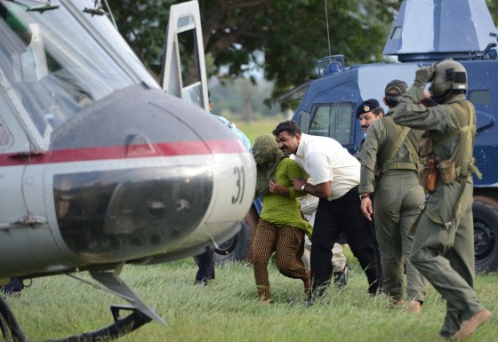 Pakistani security personnel shift Rimsha Masih (L), a Christian girl accused of blasphemy, to a helicopter after her release from jail in Rawalpindi on September 8, 2012. Masih was arrested on August 16 for allegedly burning pages containing verses from the Quran but she was released from a prison in Rawalpindi after a court accepted her bail application.